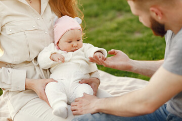 Family spend time in a summer garden