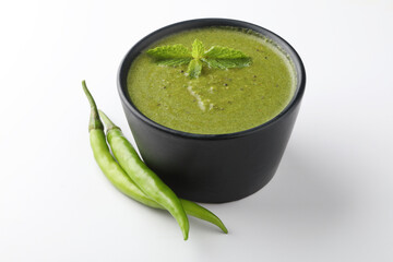 Green Mint Chutney or Pudina Chutney made with Coriander, Pudina & Spices. selective focus
