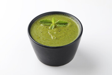 Green Mint Chutney or Pudina Chutney made with Coriander, Pudina & Spices. selective focus