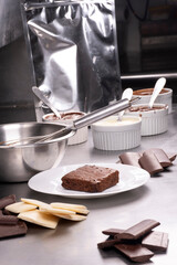 professionally producing chocolate brownie in industrial kitchen