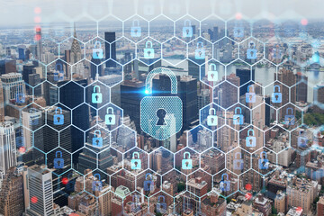 Aerial panoramic city view of Upper Manhattan area, the East Side, river and Brooklyn on horizon, New York city, USA The concept of cyber security to protect confidential information, padlock hologram