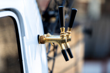Close-up of beer bus tap