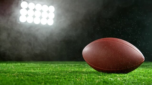 Super slow motion of football ball with smoke and rain. Filmed on high speed cinema camera, 1000fps.