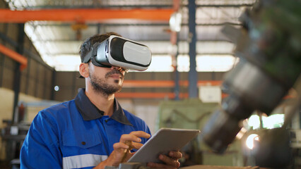 Engineer wearing virtual reality headset standing in the manufacturing factory. Moving hand and...