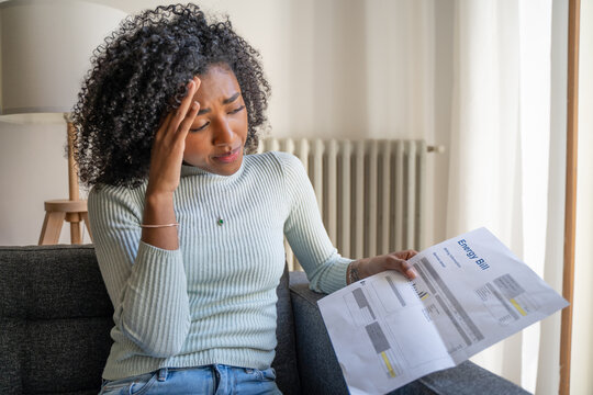One shocked black woman worried about home energy expenses