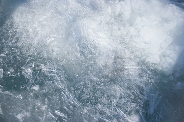 The texture of the ice is close. Lake Baikal in winter. Fresh water reserves of planet Earth. Global warming.