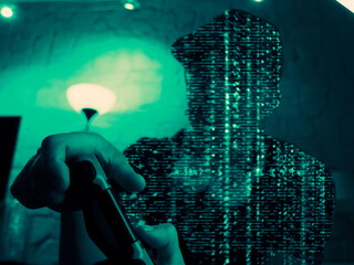 hacker shape code holding a gaming controller