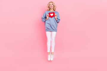 Full length photo of young lovely girl jump share repost button click user comment isolated over...