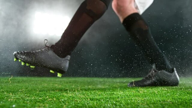 Super slow motion of soccer player kicking the ball. Filmed on high speed cinema camera, 1000fps. Speed ramp effect.