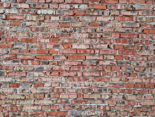 Textured background of old and worn brick wall. Close up. Copy space