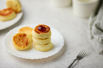  breakfast in the form of cottage cheese pancakes on a plate