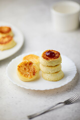  breakfast in the form of cottage cheese pancakes on a plate