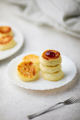  breakfast in the form of cottage cheese pancakes on a plate