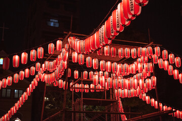 Japanese red paper lanterns for festival at night　夏祭りの赤い提灯とやぐら 夜景