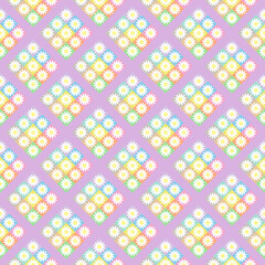 Seamless background with multicolored floral patterns on purple background.