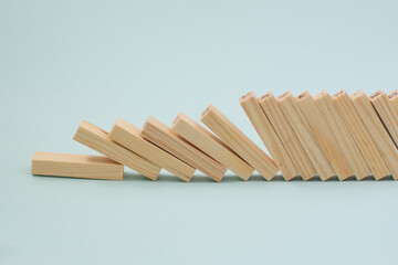 Fallen wooden blocks. The concept of business leadership