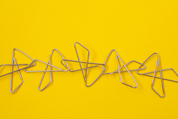 Paper clips attached to each other. Concept of partnership,cooperation,teamwork or joint venture