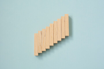 Wooden blocks cubes are stacked in ascending order . Steps. Growth and construction concept.