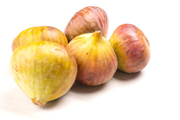 Freshly ripe figs. Healthy Mediterranean fig fruit. Fresh figs on a dark background. Beautiful blue violet figs with leaves, copy space, closeup