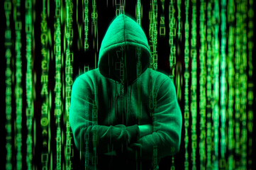 hacker Silhouette on dark green binary background. Hacker Silhouette and Binary Codes. Toned picture of silhouette of hacker in hoodie. Hacking and malware concept.