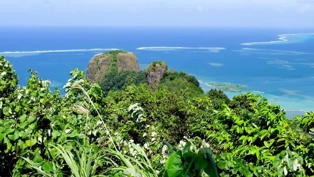 Looking out over popular tourism landmark of Sokehs Rock and deep blue ocean on a sunny, windy day in Pohnpei, Federated States of Micronesia