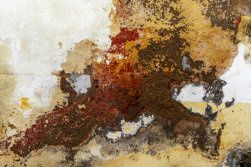 abstract colorful texture of an old house wall as a background
