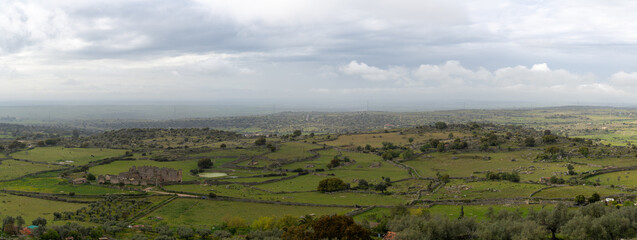 Obraz premium panorama landscape view of old rock walls and fields in the oak landscape of Extremadura