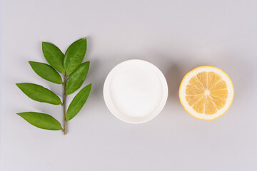 Natural homemade household cleaners - baking soda, lemon, citric acid on light gray background with...