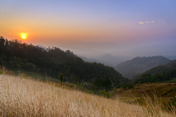 Beautiful scenery of the sunrise over the mountain and agricultural field at Hadubi, Chiang Mai, Thailand.