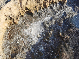 Coast of the Mediterranean Sea, long frozen lava. Background. It looks like an alien landscape.