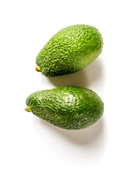 Two avocados isolated on a white background