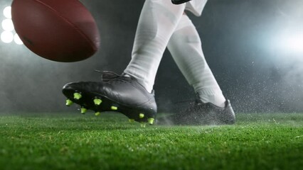 Close-up of American Football Player Kicking Ball, Super Slow Motion at 1000 fps. Filmed on High Speed Cinematic Camera.