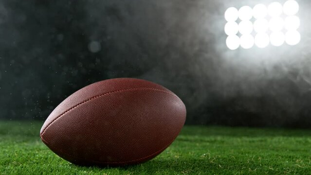 Close-up of American Football Player Kicking Ball, Super Slow Motion at 1000 fps. Filmed on High Speed Cinematic Camera.