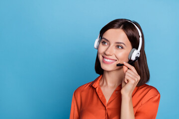 Profile side photo of young cheerful girl listen agent earphones look empty space isolated over...