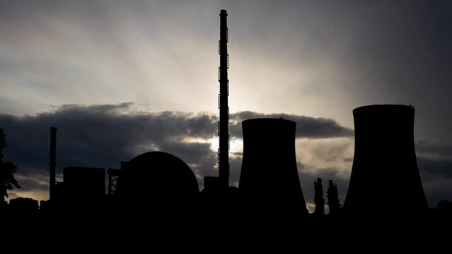 Philippsburg Nuclear Power Plant, Time Lapse at Sunrise with Fast Clouds and Dark Silhouette of Big Chimneys, Germany