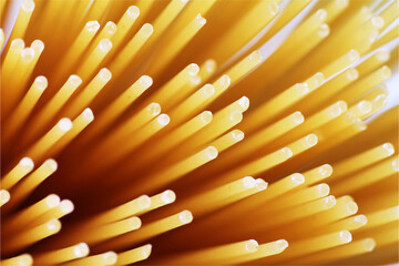 Abstract background with spaghetti sticks pattern in yellow and orange colours