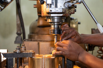 The machine operator working with NC milling machine.