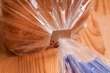 Price Tag Bread Clip on white background. Recycled cardboard paper tags on bread bag use to tell...