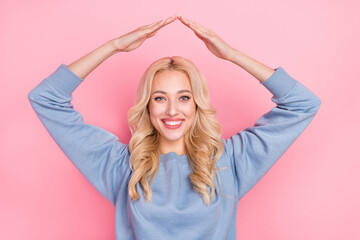 Photo of young adorable girl hands above head settlement safe relocation isolated over pink color background