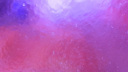 Abstract background in various light purple and pink color shades and water or glass pattern