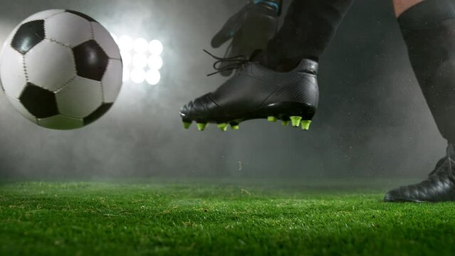 Close-up of Football Keeper Kicking Soccer Ball, Super Slow Motion at 1000 fps. Filmed on High Speed Cinematic Camera.