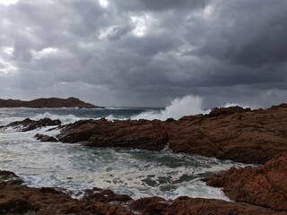 Italy, Sardinia Island: Rough sea in Isola Rossa.