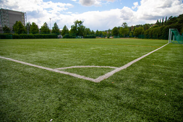 Fototapeta premium Empty football field from corner line perspective 