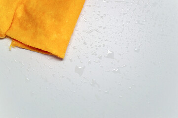 Background with wet surface of table and wet cloth.