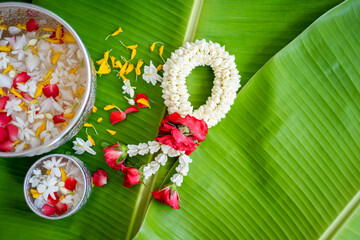 Thai traditional jasmine garland on Banana leaf. Symbol of Mother's Day or Songkran Day in Thailand.
