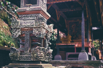 Obraz premium Decorated, stone ceremonial shrine in Ubud temple. Ubud, Bali, Indonesia.