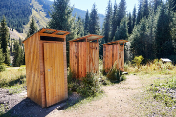 outdoor wooden toilets in the mountains in the tourist area