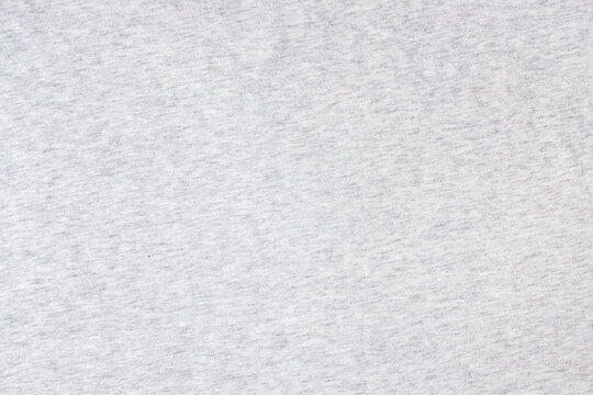Grey knitted fabric cotton textured background. Closeup with copy space for your design