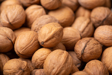 Background of walnuts. Dried walnuts in shell