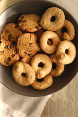 Plate of sugar cookies and chocolate chip cookies on the table. Flat lay.